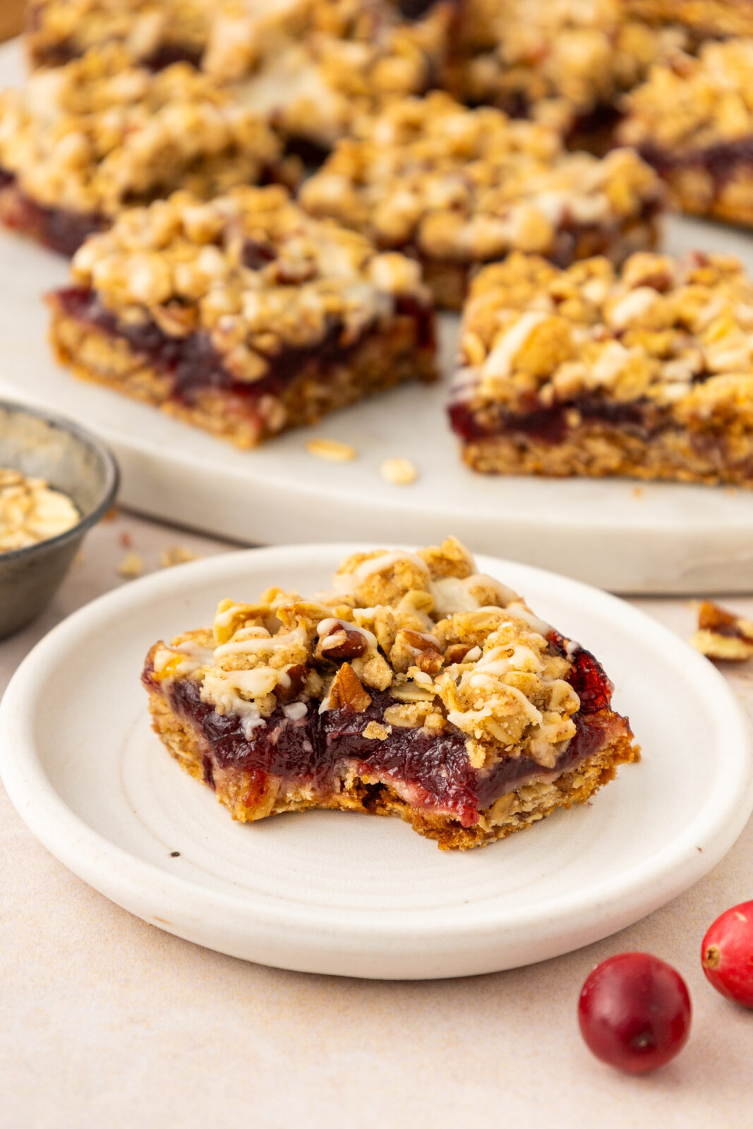 cranberry oat crumble bar on a plate