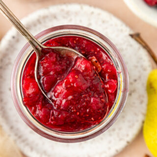 close-up of chia cranberry pear jam on a spoon