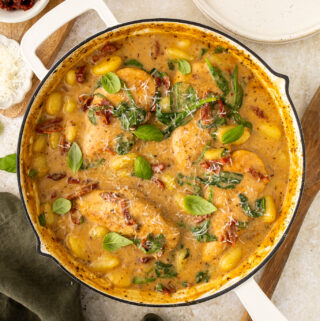 one pan with cooked chicken and gnocchi in a sundried tomato sauce