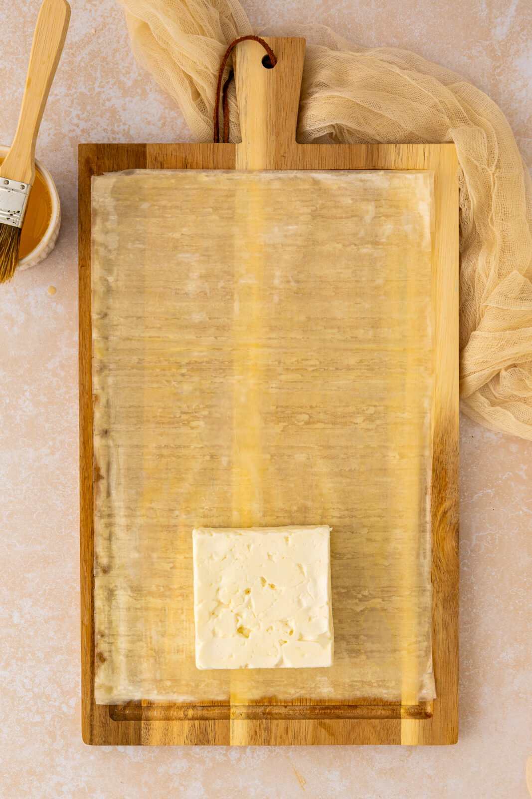 sheet of phyllo with a piece of feta cheese on top
