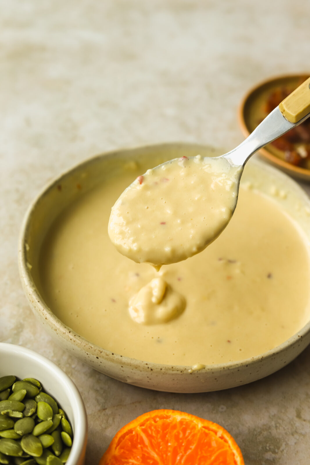 spoonful of orange tahini sauce