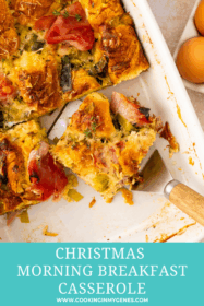 piece of ham and cheese breakfast casserole in a baking dish