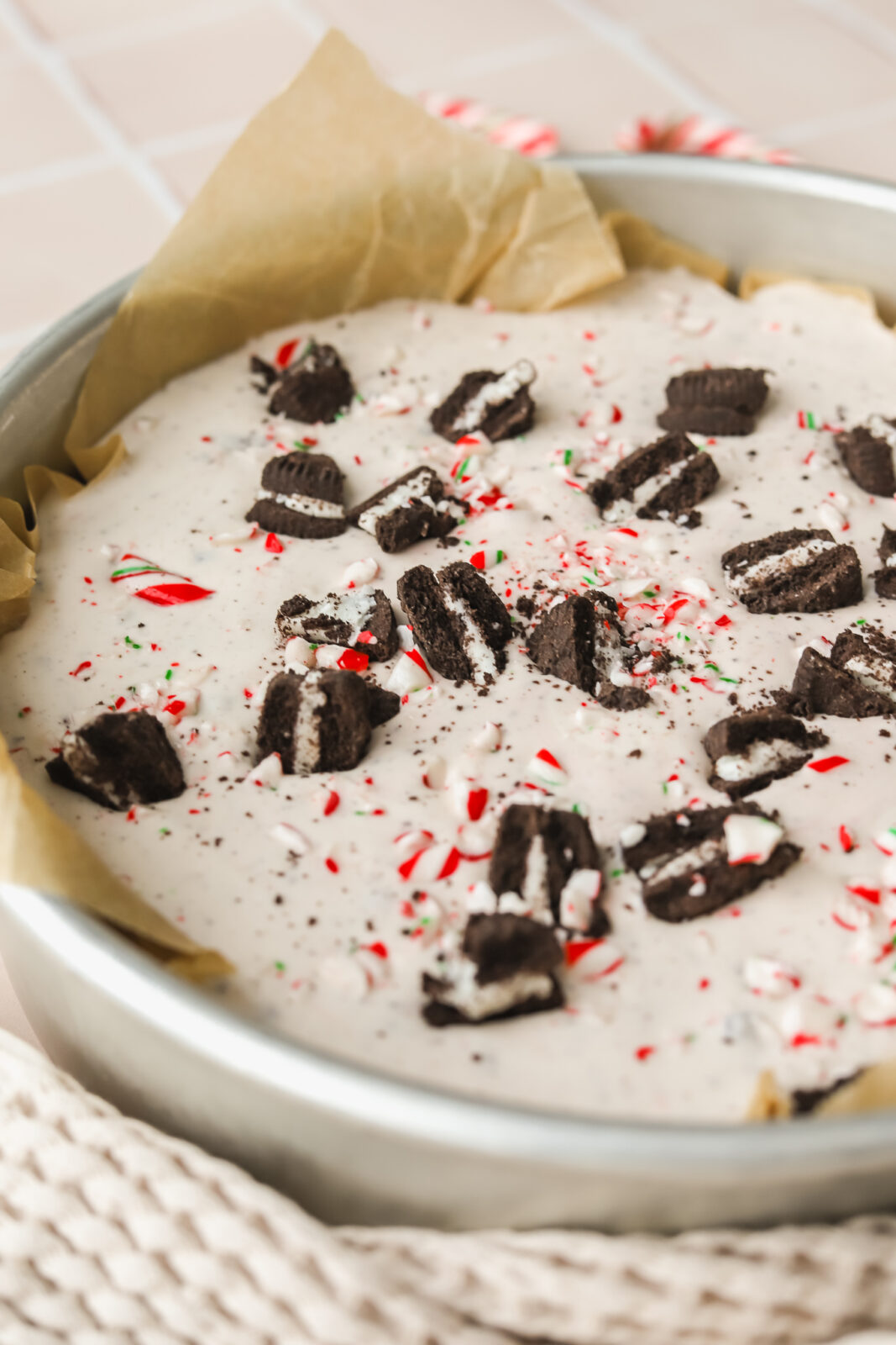 peppermint ice cream topped with candy cane and Oreo pieces