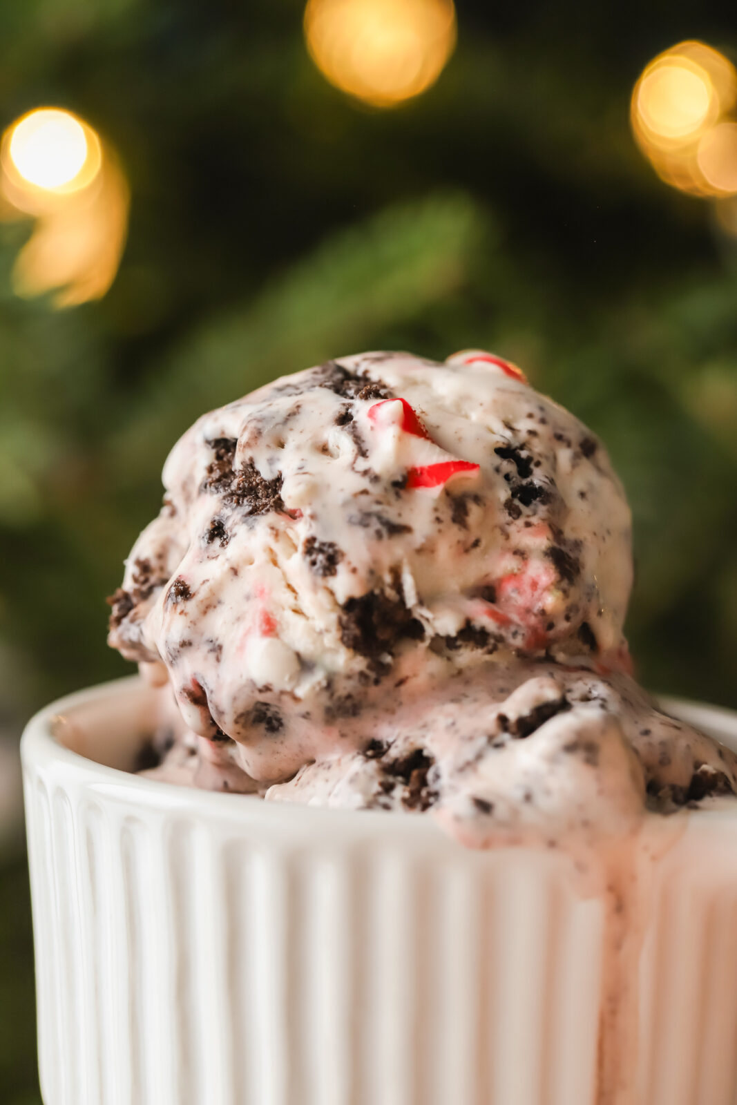close up of scoops of no churn ice cream with candy canes and Oreos in a dish