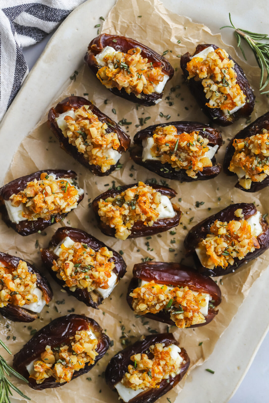 overhead shot of roasted feta stuffed dates topped with walnuts