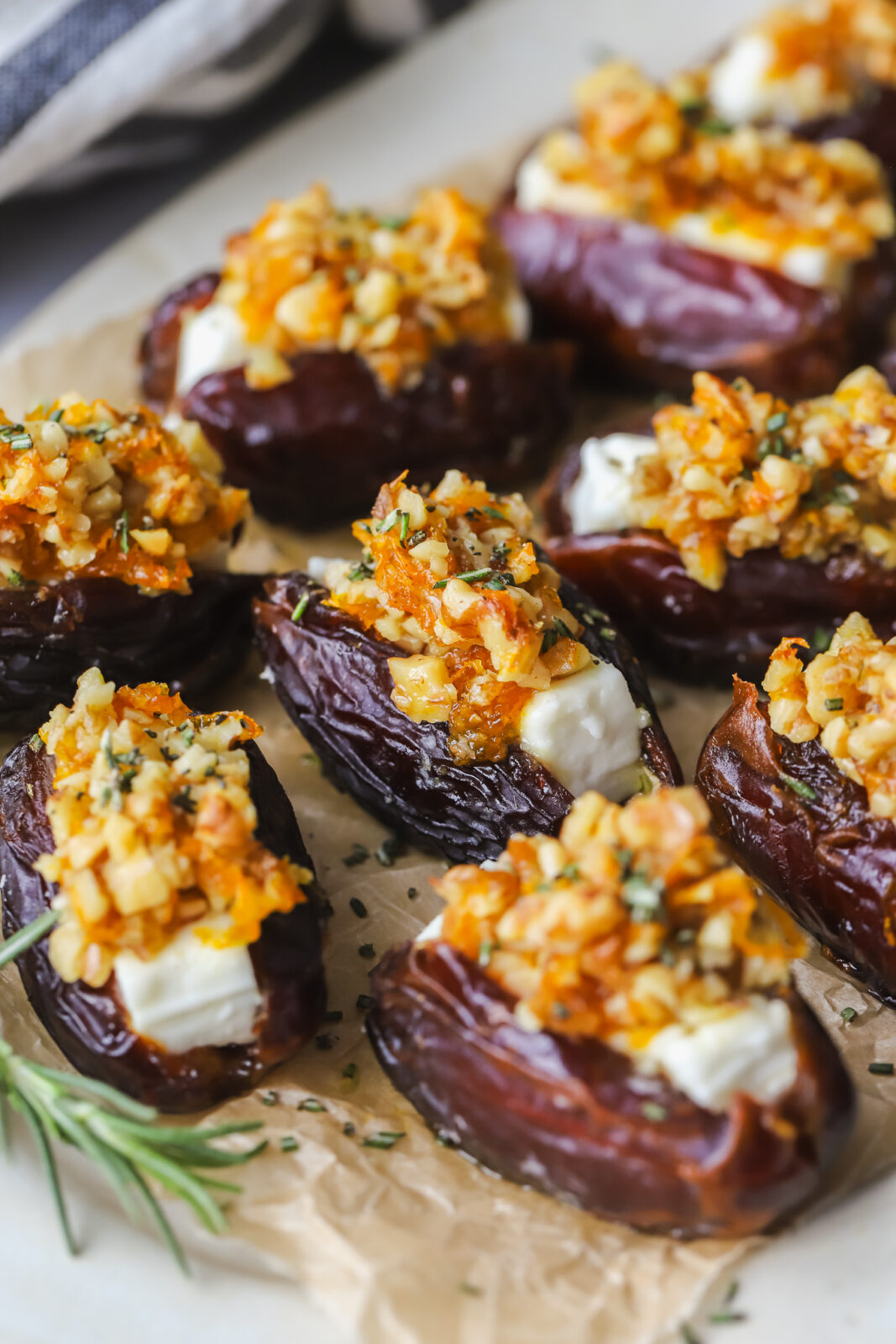 angled photo of roasted feta stuffed dates on a serving tray