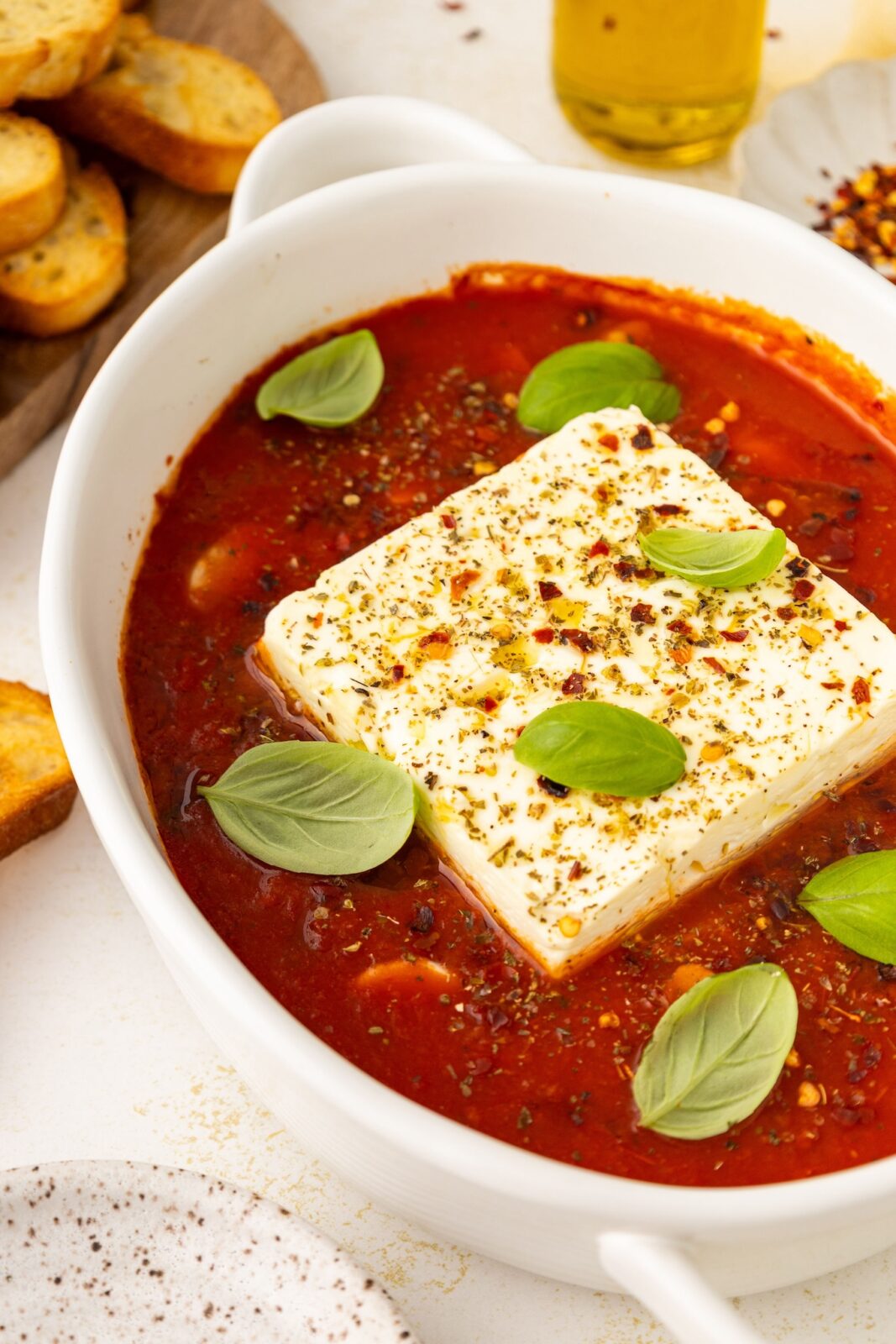side angle of baked feta in marinara