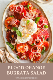 overhead of burrata ball on top of blood orange salad