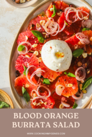 overhead of burrata ball on top of blood orange salad