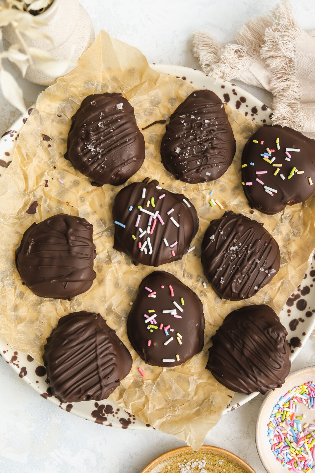 decorated peanut butter chocolate covered Easter eggs on a plate